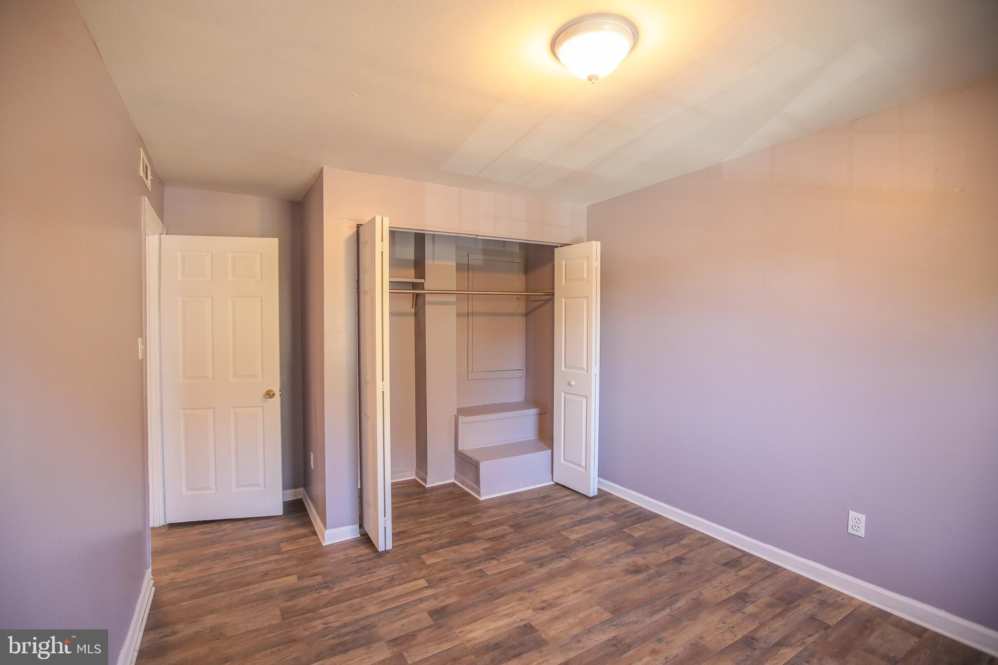1705 Addison Road South District Heights, MD 20747 - Photo 17 of 26 a view of an empty room with wooden floor