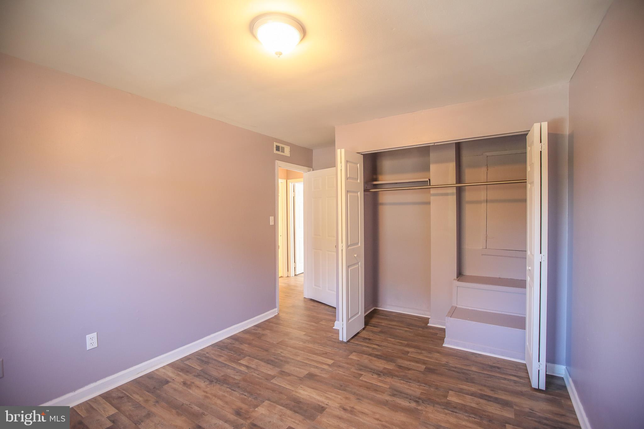 1705 Addison Road South District Heights, MD 20747 - Photo 18 of 26 a view of an empty room with closet and wooden floor