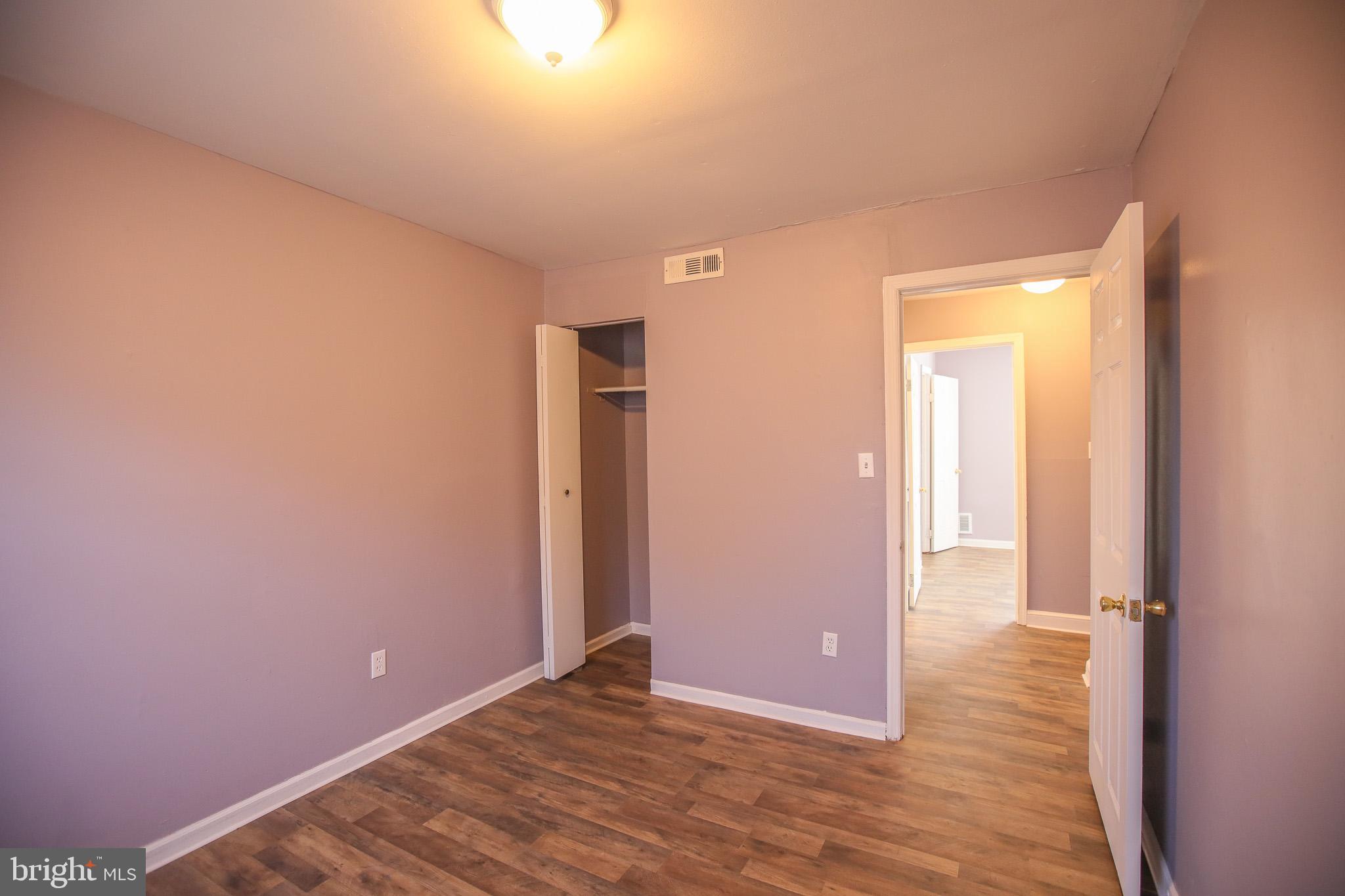 1705 Addison Road South District Heights, MD 20747 - Photo 20 of 26 a view of an empty room with wooden floor