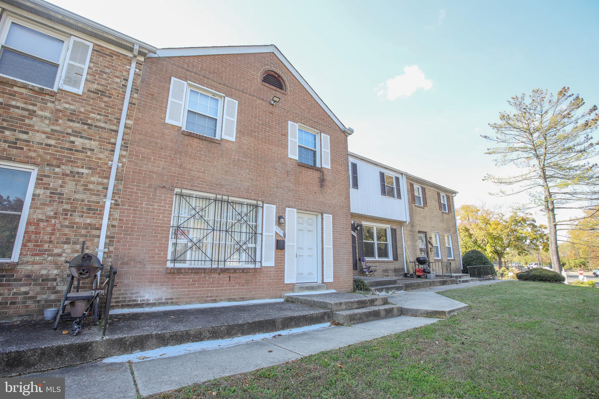 1705 Addison Road South District Heights, MD 20747 - Photo 25 of 26 a front view of a house with garden