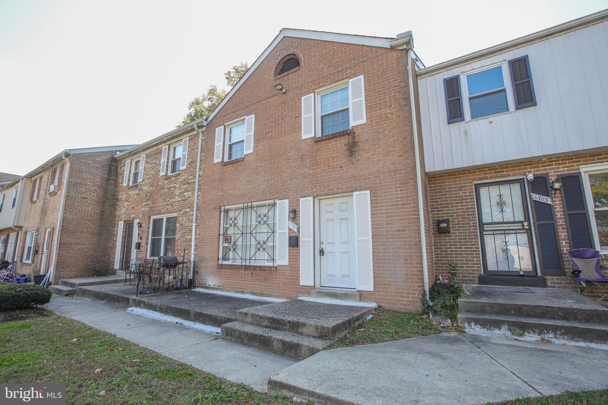 1705 Addison Road South District Heights, MD 20747 - Photo 26 of 26 a front view of a house with a yard