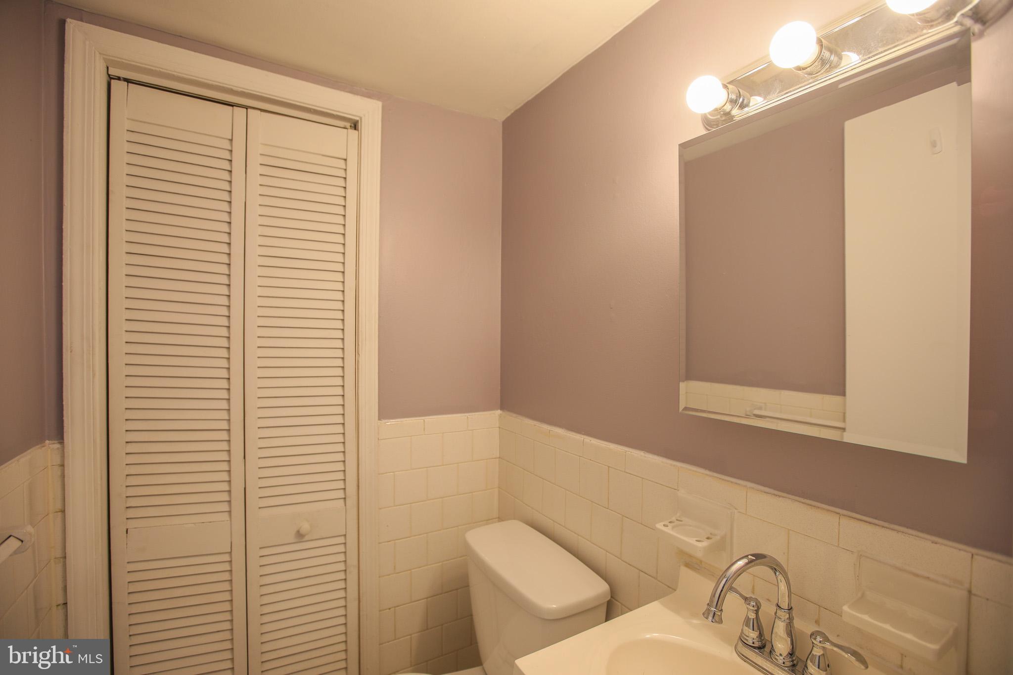 1705 Addison Road South District Heights, MD 20747 - Photo 10 of 26 a bathroom with a toilet and a sink