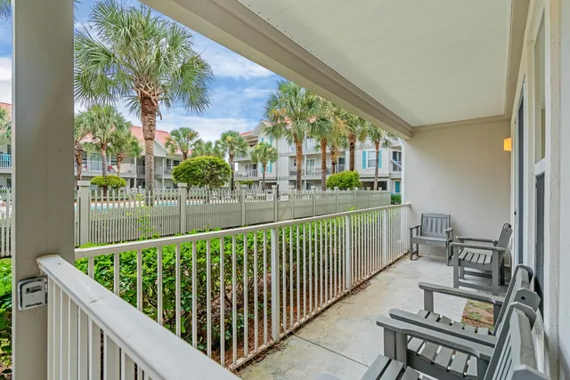a view of balcony with furniture