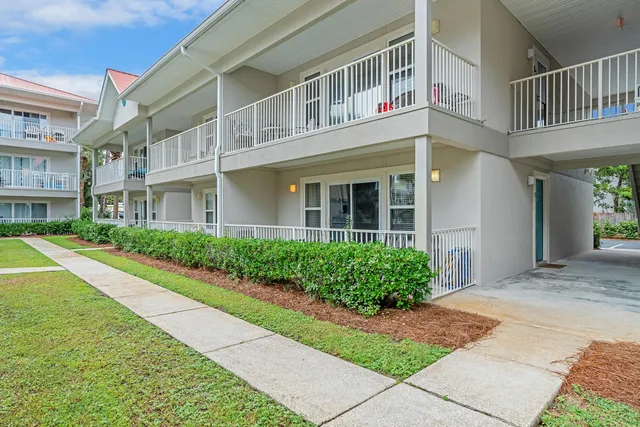 a front view of a building with garden