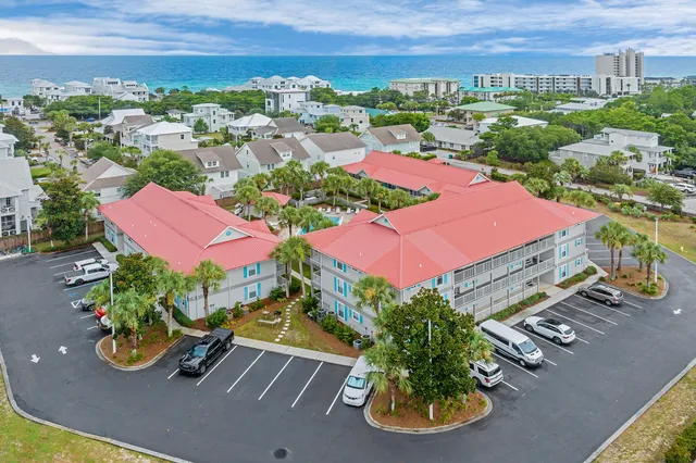an aerial view of a house with yard swimming pool and outdoor seating