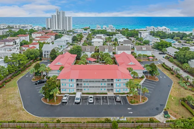 an aerial view of a house with garden space and outdoor seating