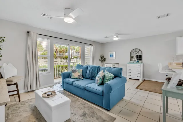 a living room with furniture and a window