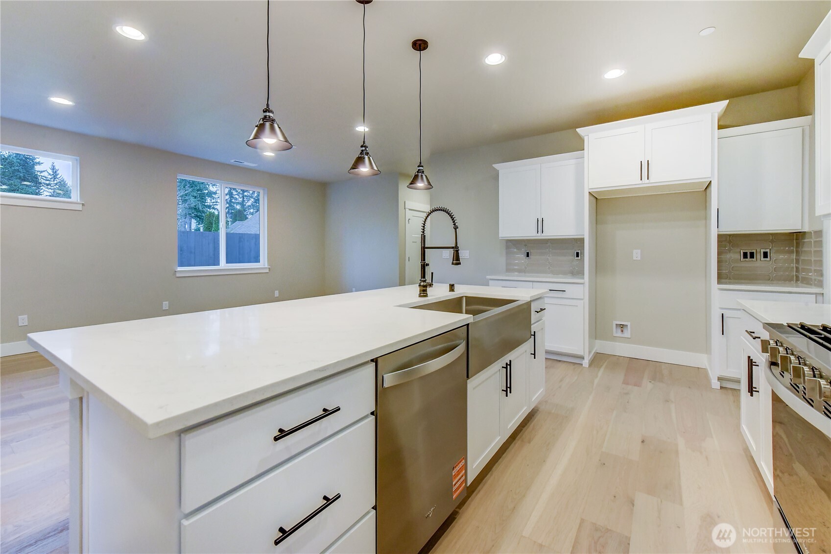 18425 Meridian Avenue Southeast, Unit CR 26 Bothell, WA 98012 - Photo 12 of 35 a kitchen that has a lot of cabinets in it and wooden floors