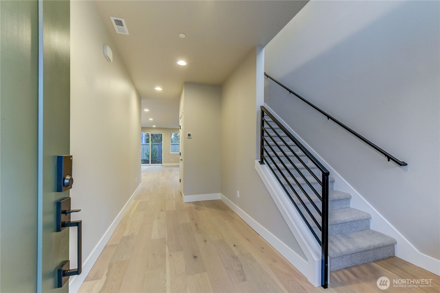 18425 Meridian Avenue Southeast, Unit CR 26 Bothell, WA 98012 - Photo 4 of 35 a view of a hallway with wooden floor and staircase