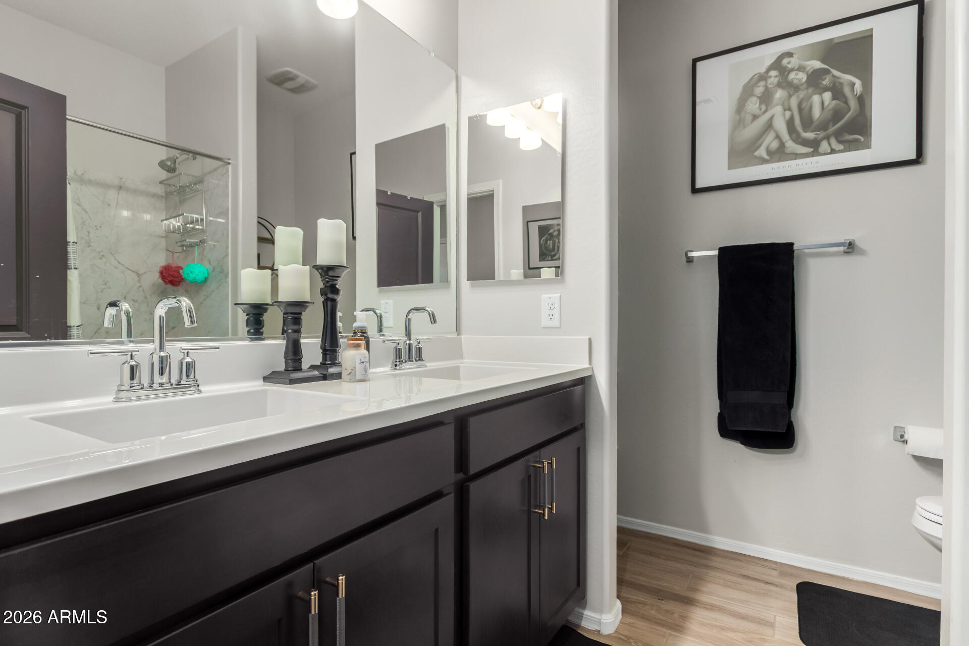 10329 West Gaby Road Tolleson, AZ 85353 - Photo 13 of 22 a bathroom with a double vanity sink and a mirror