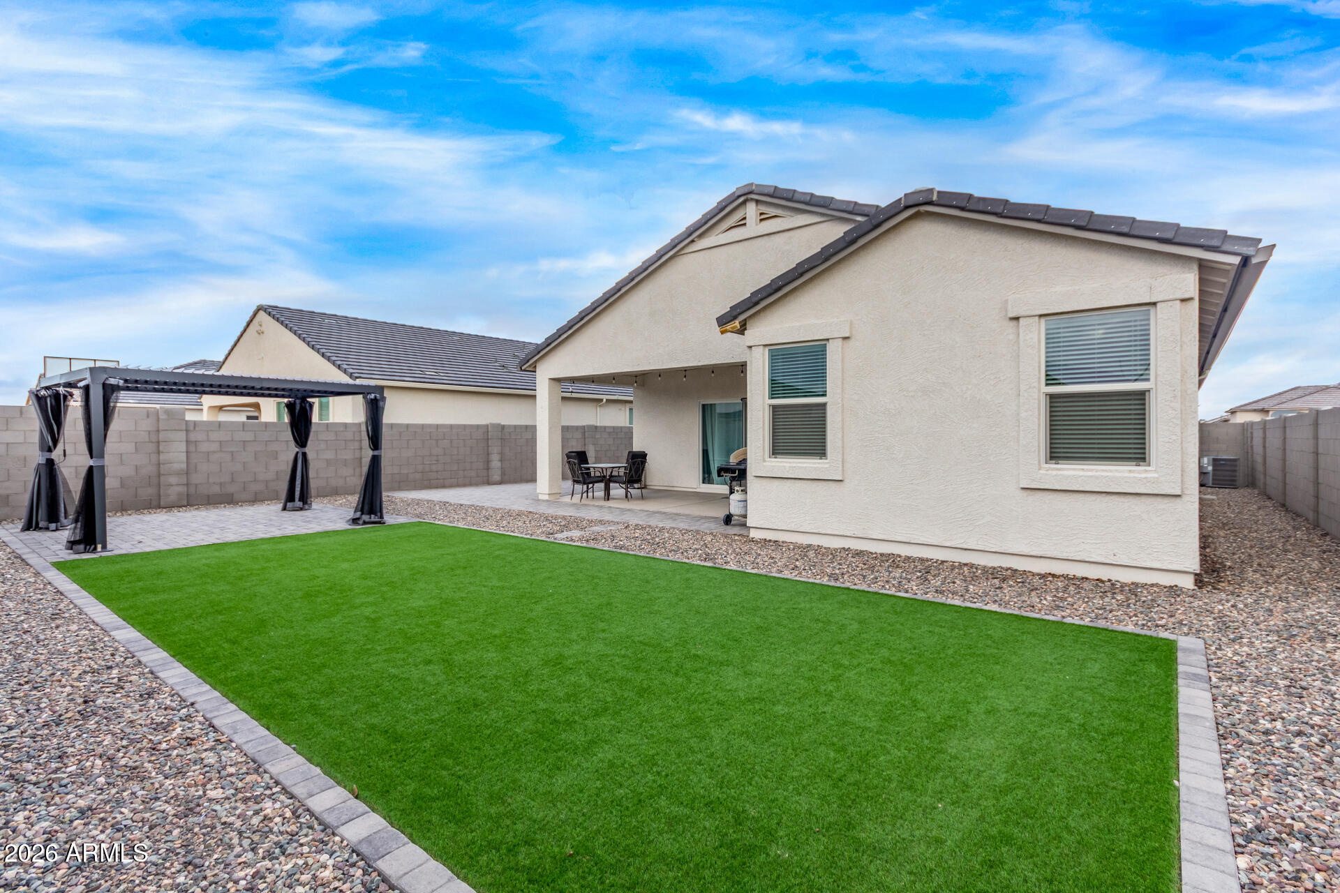 10329 West Gaby Road Tolleson, AZ 85353 - Photo 21 of 22 a view of a house with a yard