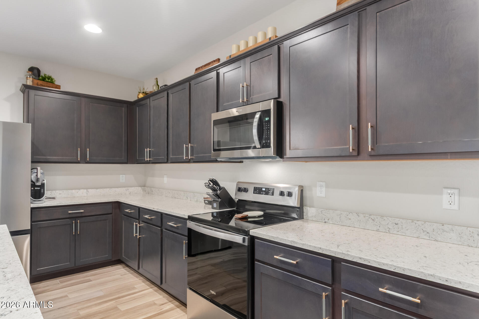 10329 West Gaby Road Tolleson, AZ 85353 - Photo 7 of 22 a kitchen with a sink and cabinets