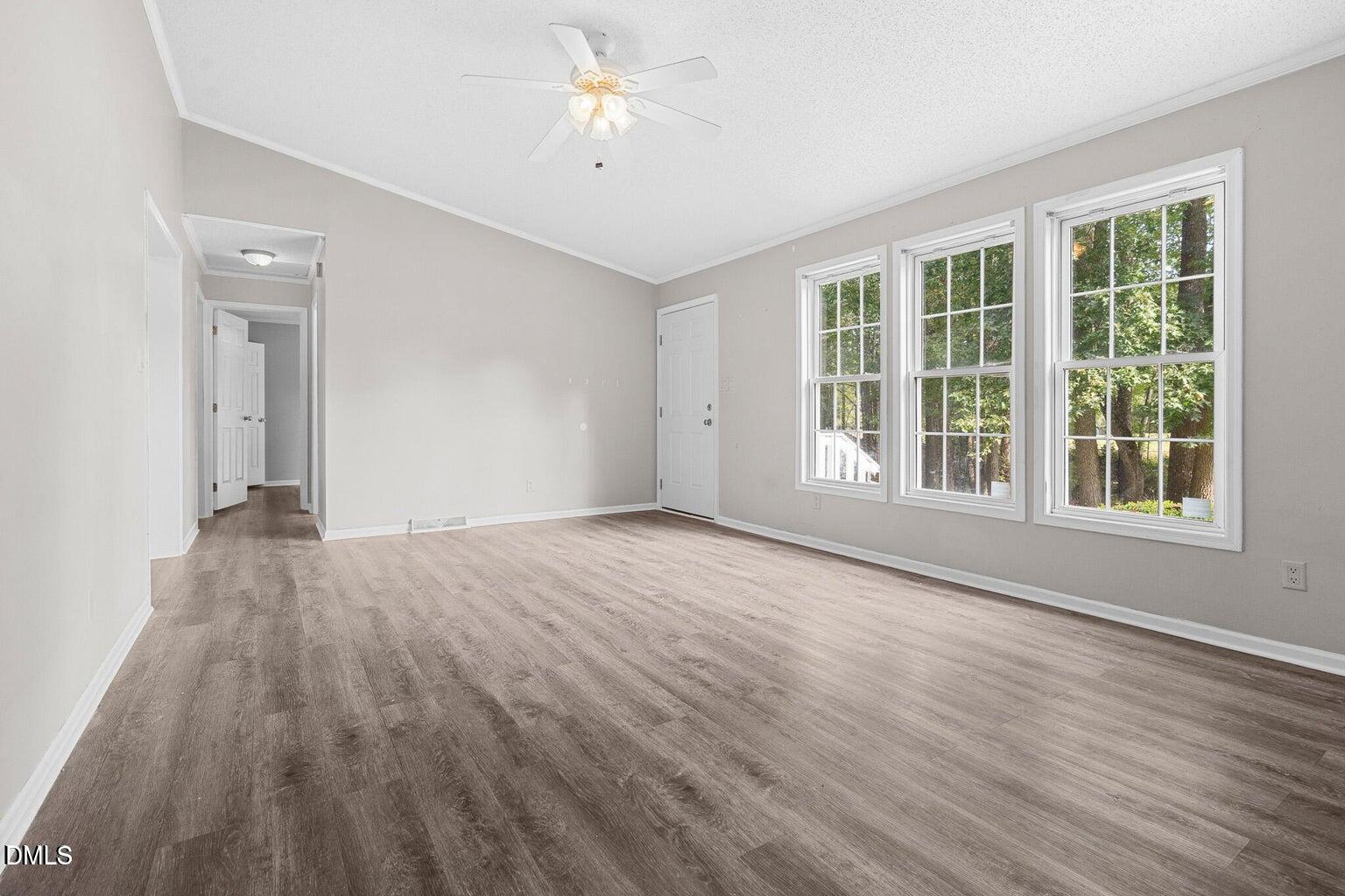 4551 Sugar Maple Road Oxford, NC 27565 - Photo 12 of 23 a view of an empty room with a window and wooden floor