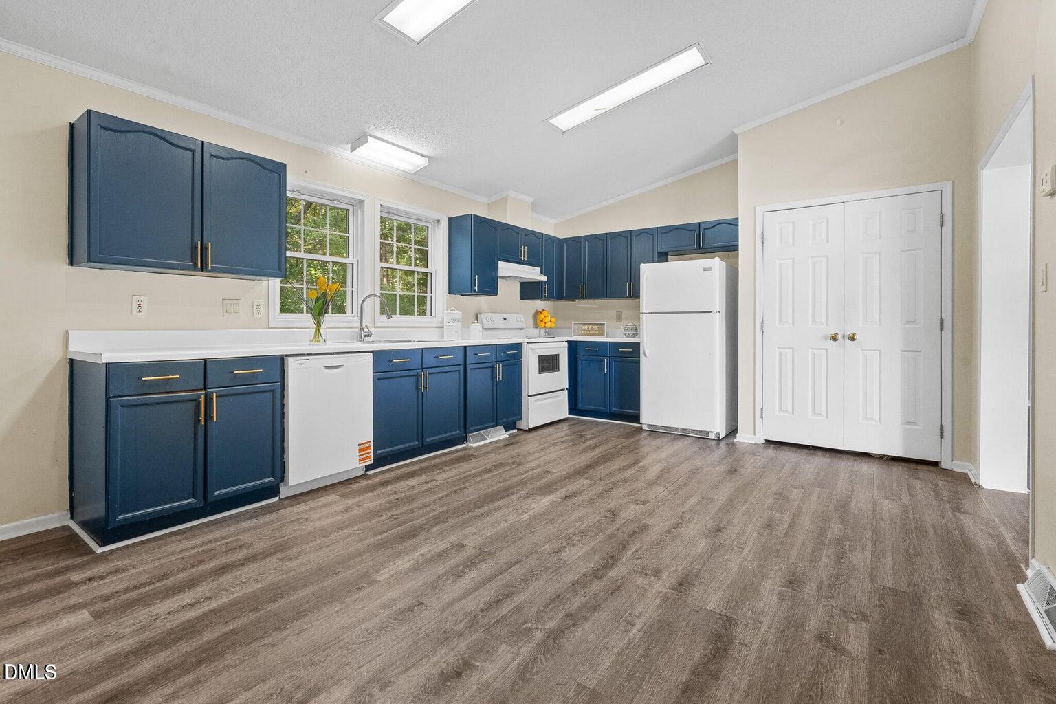4551 Sugar Maple Road Oxford, NC 27565 - Photo 13 of 23 a kitchen with a sink cabinets and wooden floor