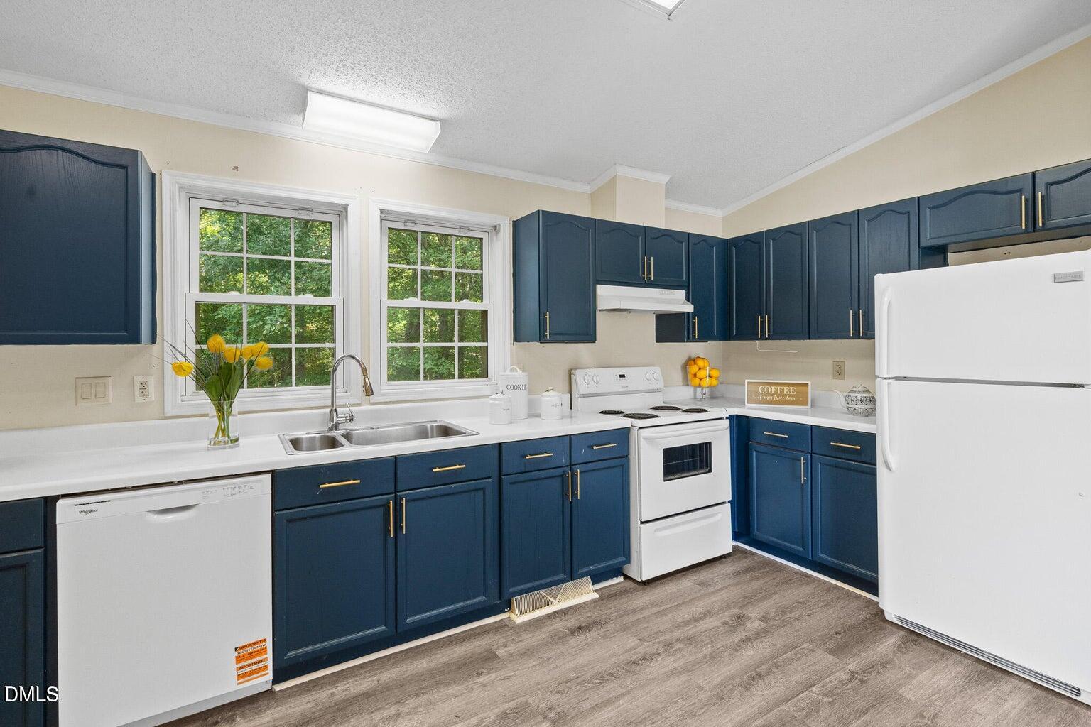 4551 Sugar Maple Road Oxford, NC 27565 - Photo 14 of 23 a kitchen with a sink a stove a refrigerator and a oven