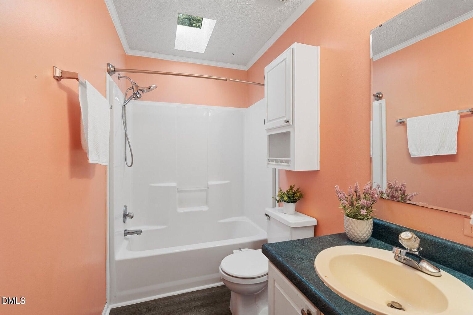 4551 Sugar Maple Road Oxford, NC 27565 - Photo 22 of 23 a bathroom with a sink toilet and shower