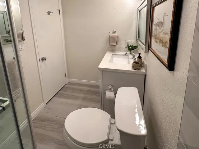 a bathroom with a toilet mirror and tub