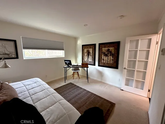 a bedroom with a bed furniture and a window