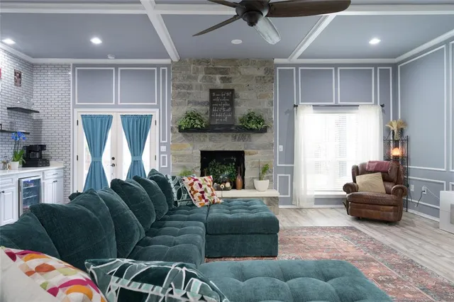 a living room with furniture and a fireplace