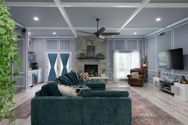 a living room with furniture and a fireplace