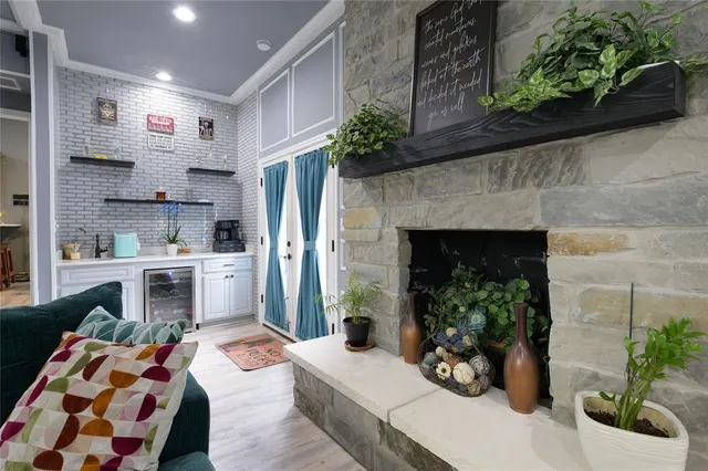 a kitchen with furniture and a fireplace