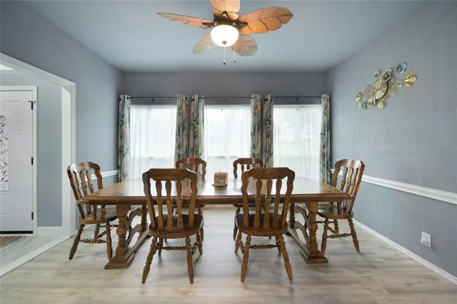 a view of a dining room with furniture window and outside view
