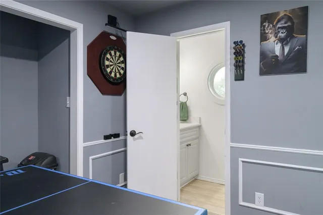 a room with a walk in closet and a mirror