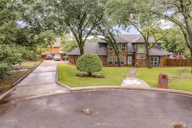 a view of house with outdoor space and swimming pool