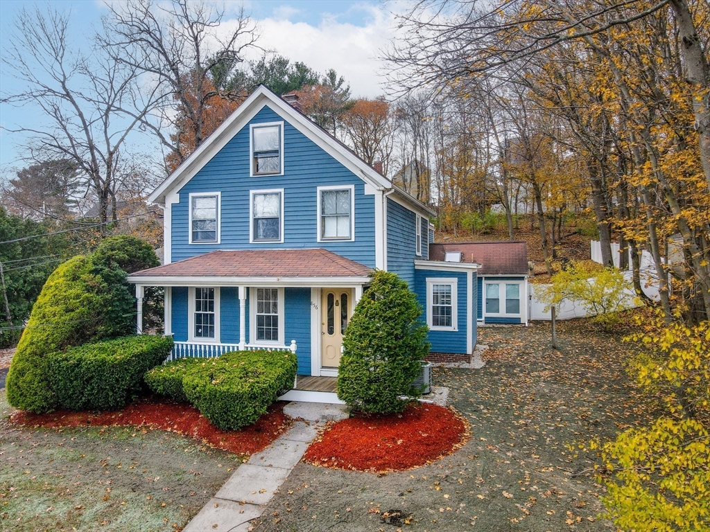 856 Main Street Reading, MA 01867 - Photo 2 of 41 front view of a house with a yard