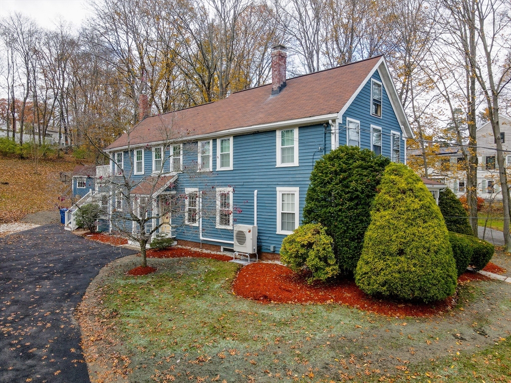 856 Main Street Reading, MA 01867 - Photo 30 of 41 front view of a house with a yard