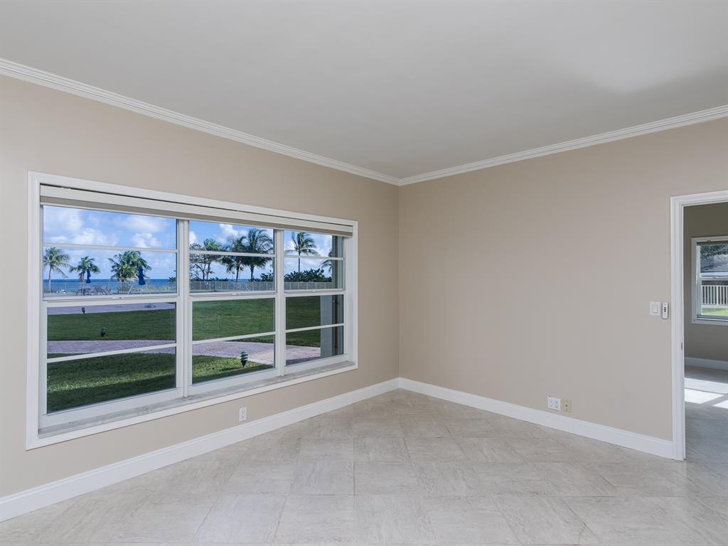750 North Ocean Boulevard, Unit 210 Pompano Beach, FL 33062 - Photo 11 of 57 a view of an empty room with a window