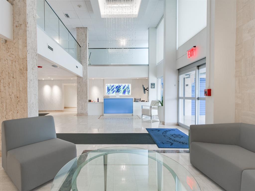 750 North Ocean Boulevard, Unit 210 Pompano Beach, FL 33062 - Photo 33 of 57 a living room with furniture and wooden floor