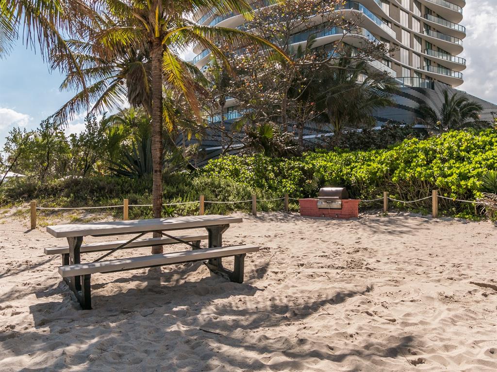 750 North Ocean Boulevard, Unit 210 Pompano Beach, FL 33062 - Photo 37 of 57 a view of a bench in a backyard