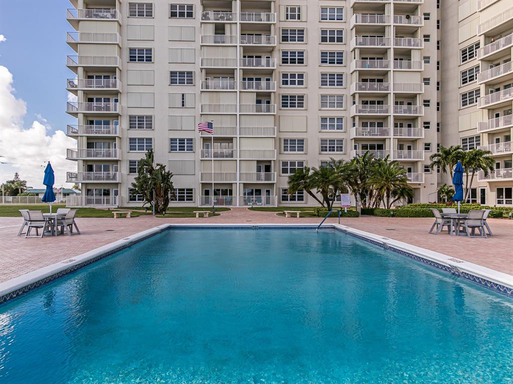 750 North Ocean Boulevard, Unit 210 Pompano Beach, FL 33062 - Photo 45 of 57 a swimming pool with outdoor seating and yard