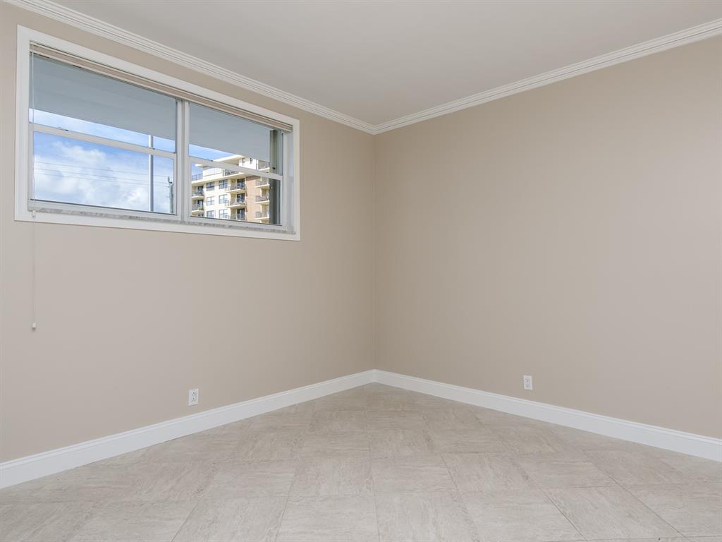 750 North Ocean Boulevard, Unit 210 Pompano Beach, FL 33062 - Photo 50 of 57 an empty room with a window