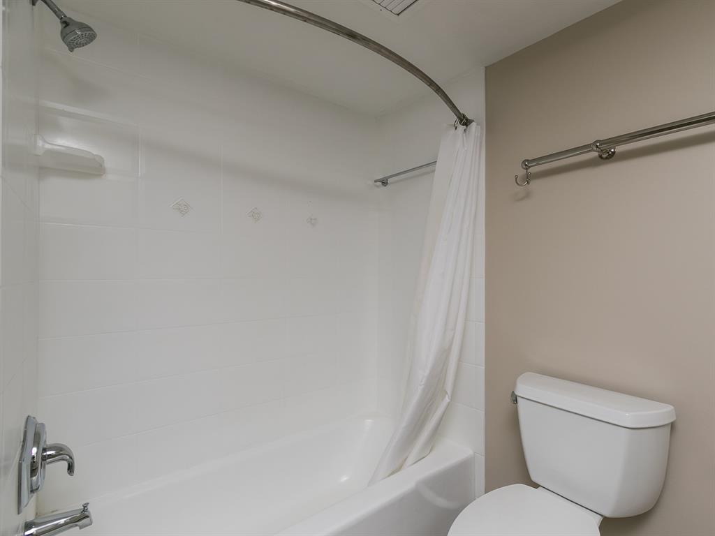 750 North Ocean Boulevard, Unit 210 Pompano Beach, FL 33062 - Photo 57 of 57 a white toilet sitting next to a bathroom sink