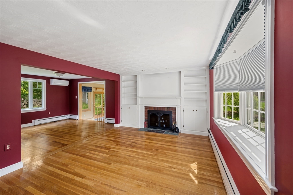 40 Bell Road Weymouth, MA 02188 - Photo 9 of 41 a view of an empty room with wooden floor and a window
