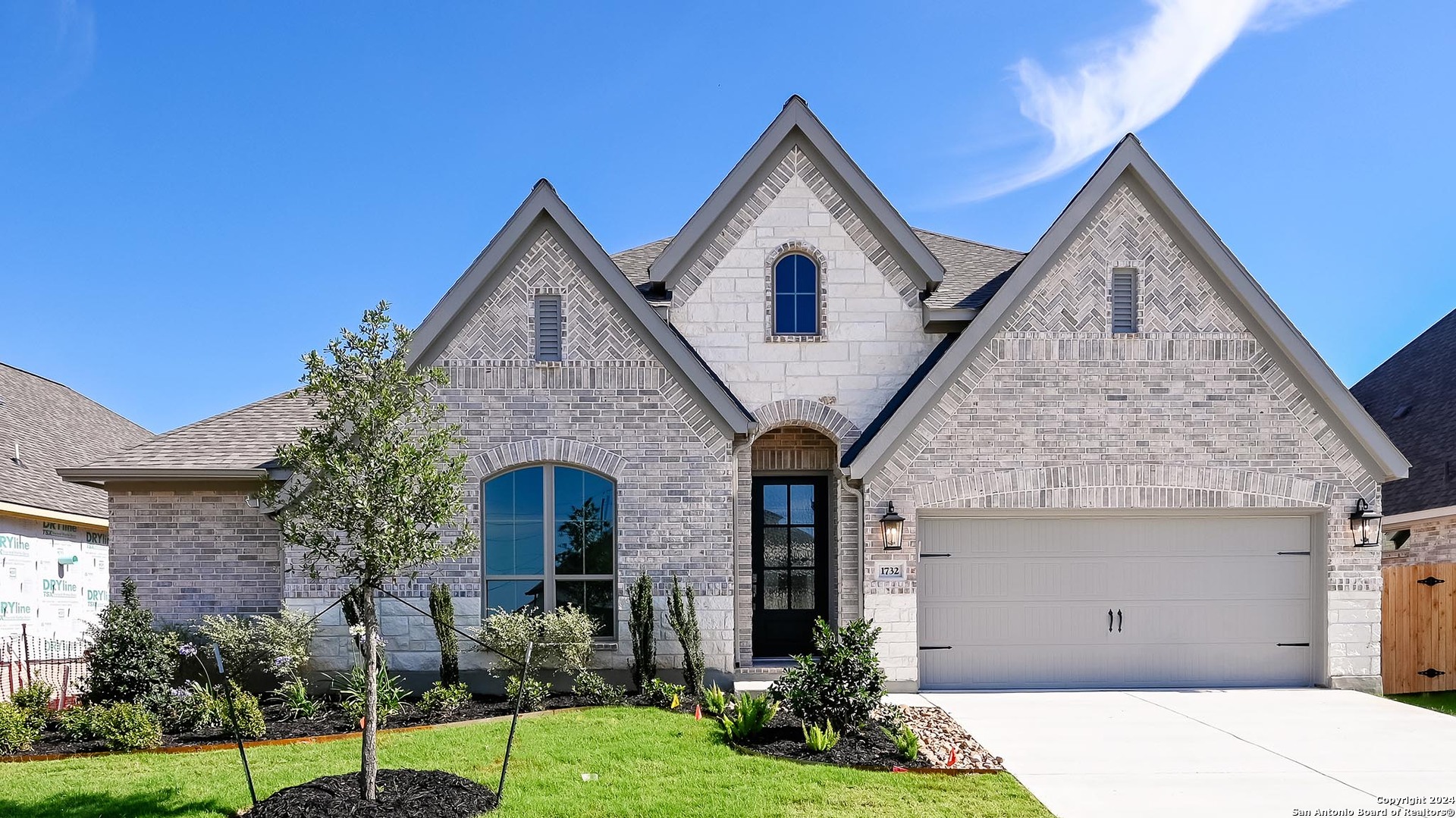 1732 Windward Way Seguin, TX 78155 - Photo 1 of 1 a front view of a house with a yard and garage