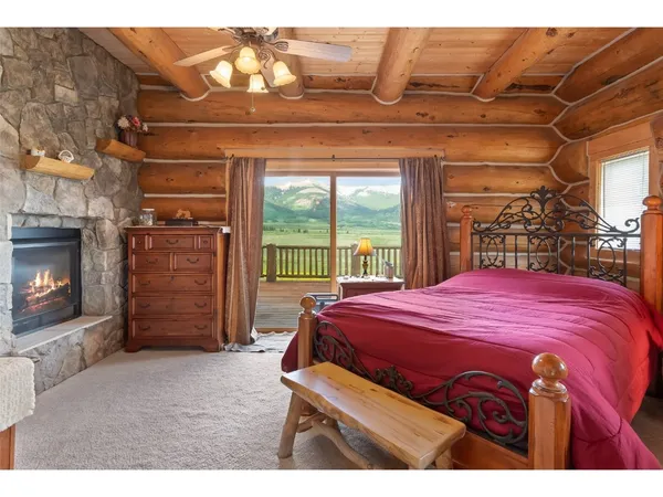 a bedroom with a bed and a fireplace