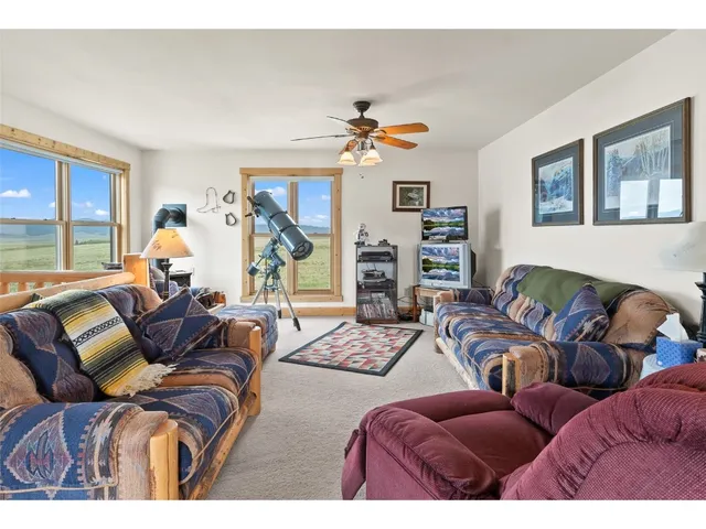 a bedroom with a bed next to a window