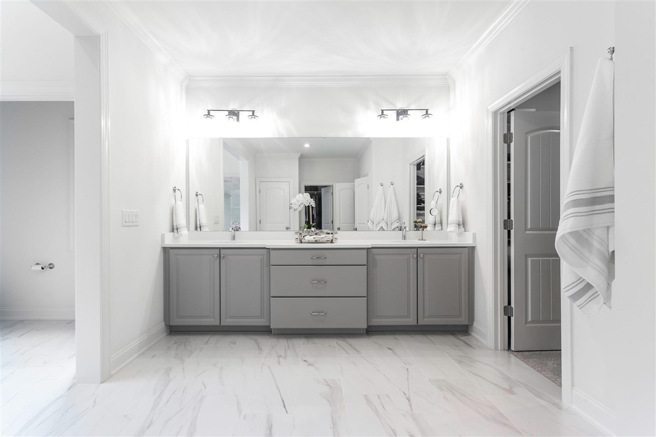 12309 Kyle Abbey Lane Raleigh, NC 27613 - Photo 15 of 30 Elegant vanity with radiant heated tile floors.