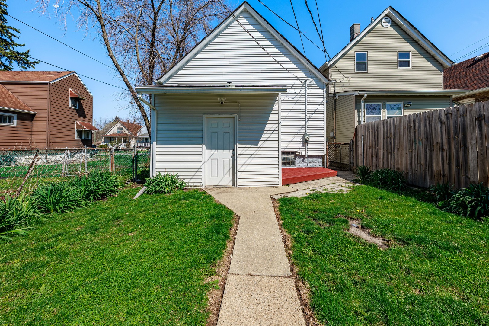 82 Isa Avenue Chicago Heights, IL 60411 - Photo 16 of 16 a front view of a house with a yard