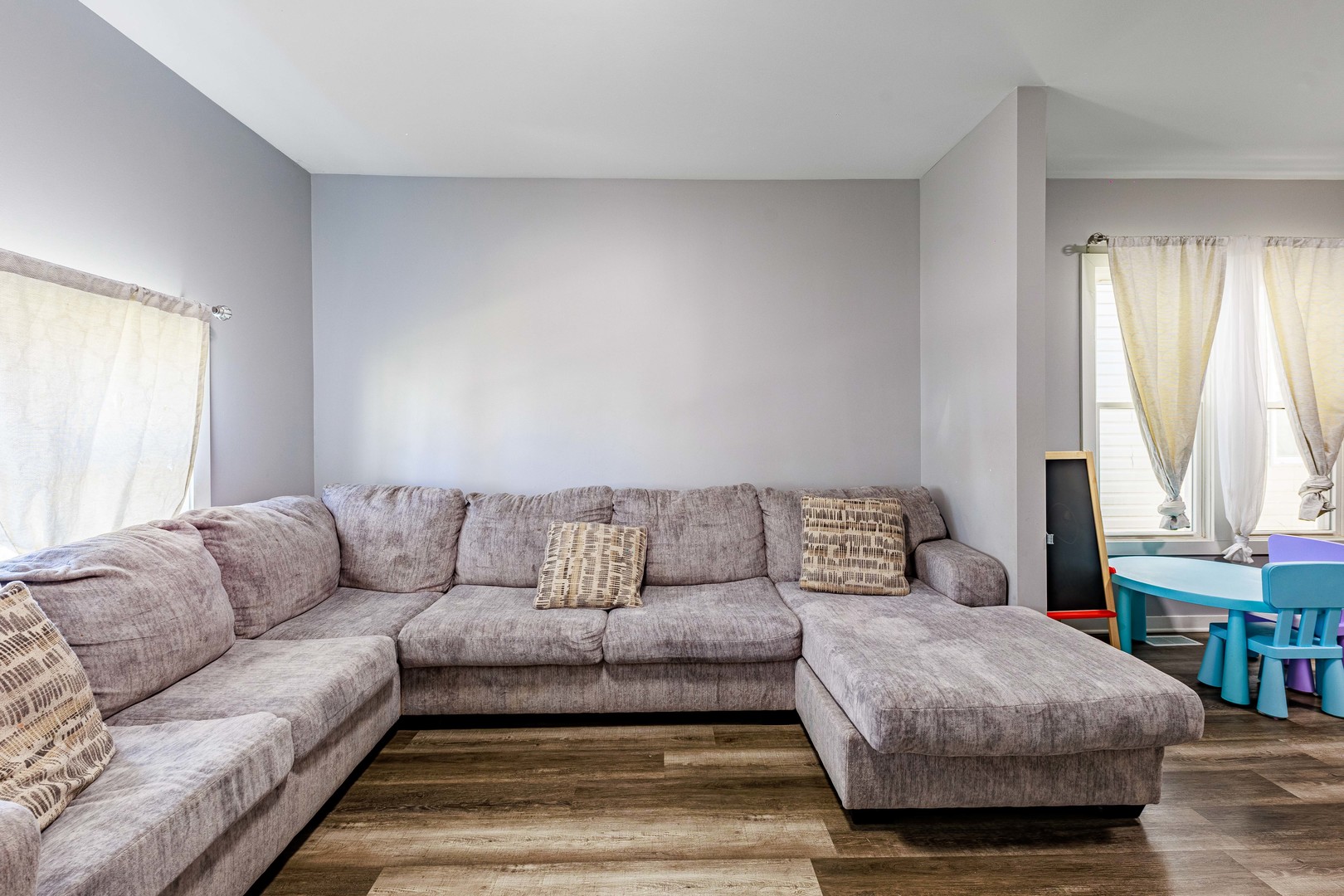 82 Isa Avenue Chicago Heights, IL 60411 - Photo 5 of 16 a living room with furniture and a large window