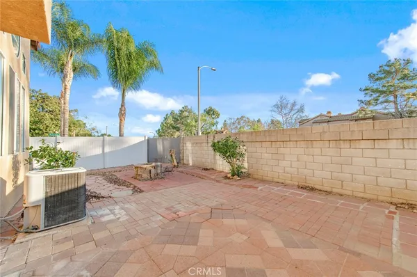 a view of a patio with a backyard