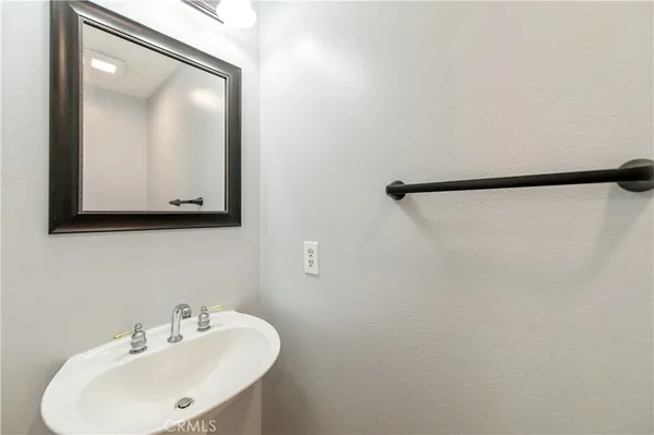 a bathroom with a sink and mirror