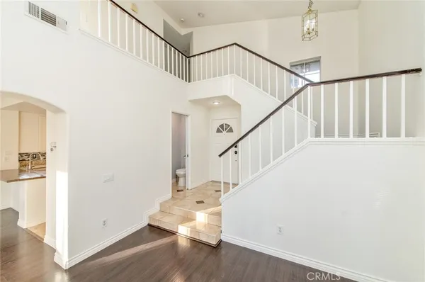 a view of entryway with wooden floor