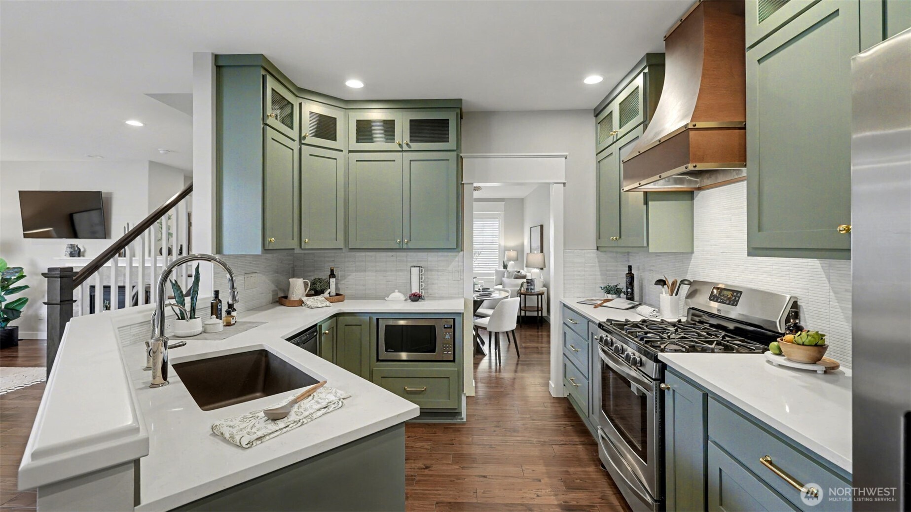 4817 Hartford Way Mukilteo, WA 98275 - Photo 11 of 36 a kitchen with a stove sink and cabinets