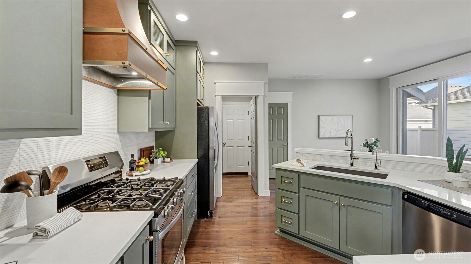 4817 Hartford Way Mukilteo, WA 98275 - Photo 12 of 36 a kitchen with sink stove and refrigerator