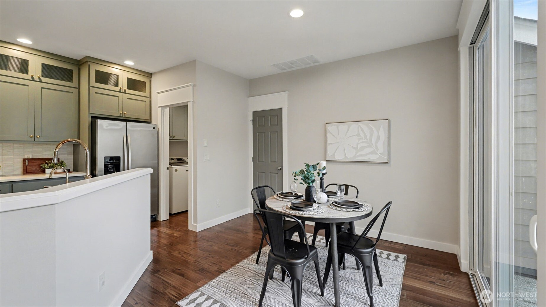4817 Hartford Way Mukilteo, WA 98275 - Photo 16 of 36 a view of a dining room with furniture and wooden floor