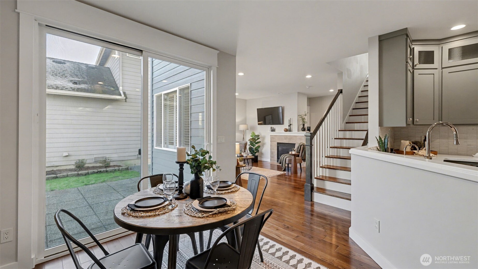 4817 Hartford Way Mukilteo, WA 98275 - Photo 17 of 36 a view of a dining room with furniture window and wooden floor